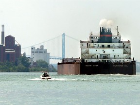The bulk carrier, Mesabi Miner, is navigated downstream on the Detroit River between Windsor, Ontario and Detroit, Michigan on Aug 9, 2017.