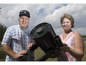 Steve Pellarin and Nancy Ng, members of the Windsor Centre of the Royal Astronomical Society of Canada, next to an eight-inch folding reflecting telescope, Aug. 11, 2017.  Both will be joined by other astronomy enthusiasts for a Perseid meteor shower all-nighter at Point Pelee National Park Saturday.