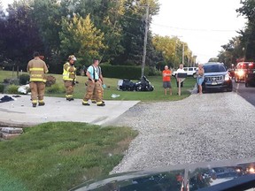 A reader-submitted image of firefighters dealing with the scene of a fatal motorcycle crash on County Road 27 in the Lakeshore area on the night of Aug. 20, 2017.