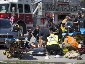 Emergency crews work at the scene of a motorcycle and car collision at Prince Rd. and Dorchester Rd, Wednesday, Aug 2, 2017.