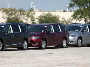 Chrysler Pacificas are lined up on a holding lot near Provincial Road in Windsor, Ontario on Aug. 3, 2017.