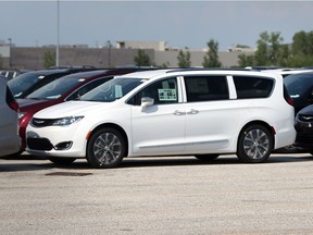 Chrysler Pacificas are lined up on a holding lot near Provincial Road in Windsor, Ontario on August 3, 2017.