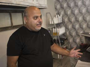 Youssef Greige, owner of the Youssef Hair Salon, says he consistently saw people sleeping in the back alley of the Pelissier Street parking garage, Monday, August 7, 2017.