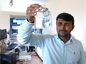 Subba Rao Chaganti, a professor and researcher at the University of Windsor Great Lakes Institute for Environmental Research, examines water samples on Aug. 15, 2017, in Windsor.