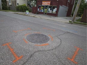 Markings surround a manhole cover on Assumption Street on Aug. 24, 2017, ahead of sewer work that will close portions of Assumption Street and Moy Avenue beginning next week.