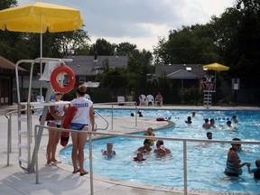 Lifeguards stand watch at Riverside Centennial pool in Windsor on Aug. 1, 2010.