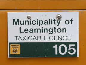 A taxi licence on a Leamington Yellow Taxi van is shown on Aug. 15, 2017.