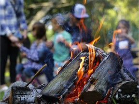 (file) The Champagne family prepare to roast marshmallows during the GreenUp 25th anniversary celebration on Aug. 24, 2017.