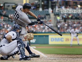 New York Yankees' Aaron Judge hits an RBI double against the Detroit Tigers during the third inning of a baseball game Wednesday, Aug. 23, 2017, in Detroit. (AP Photo/Duane Burleson)