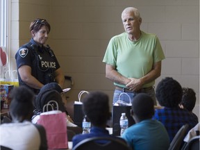 Windsor Police Senior Const. Mike McKenzie speaks to a group at the Youth in Action Initiative at the Sandwich Teen Action Group, Saturday, Aug. 12, 2017.