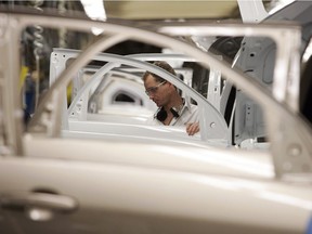 Doors and window openings line up on the Trim line, where window regulators, trim panels and window glass is installed at the CAMI Automotive facility in Ingersoll, Ontario, on Dec. 21, 2006.