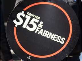 A sign supporting a $15-an-hour minimum wage is shown on April 15, 2016.