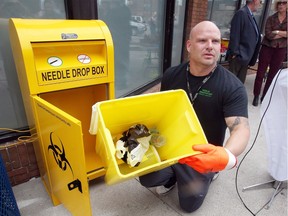 Registered practical nurse Jeremy Wigfield displays dozens of needles inside the city's first public sharps disposal kiosk at Windsor Essex Community Health Centre on Pelissier Street in Windsor on Sept. 13,  2017. The needle drop box will be open year-round and is located beside large garbage and recycling collection cans. The disposal kiosk has already collected more than 500 needles since it was installed last week.