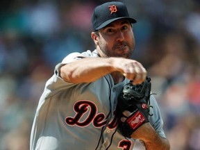 Detroit Tigers starting pitcher Justin Verlander makes a pickoff throw to first base to keep Colorado Rockies&#039; Charlie Blackmon close to the bag in the third inning of a baseball game Wednesday, Aug. 30, 2017, in Denver. The Tigers won 6-2. (AP Photo/David Zalubowski)