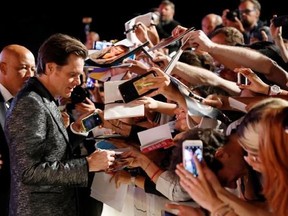 Actor Jim Carrey signs autographs at the premiere of the film &#039;Jim and Andy: The Great Beyond&#039; at the 74th edition of the Venice Film Festival in Venice, Italy, Tuesday, Sept. 5, 2017. (AP Photo/Domenico Stinellis)