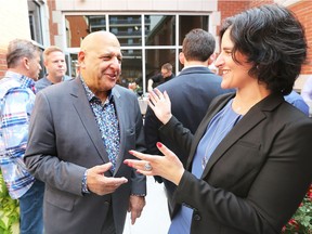 Senior Partner Harvey Strosberg has some fun with Samantha Greenspan during the grand opening of the new offices of Strosberg Sasso Sutts LLP law firm at 1561 Ouellette Ave. on September 15, 2017.