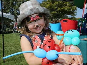 Lucy Rideout-Arkell, 4, holds a love bug and ninja turtle at the Windsor Junior Magic Club display, part of the How-To Festival at Forest Glade Library, Sept. 16, 2017.