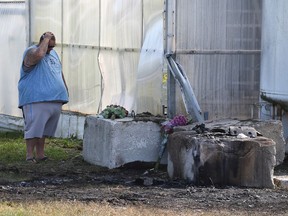 Joe Young mourns the death of his friend Brandon Froese and his companion Miranda Brown at the fatal crash scene at 1102 Mersea Road 5 in Leamington on Sept. 17, 2017.