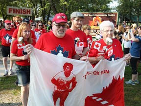 Cancer survivors David Dauphinee, front left, and Norma Forget, right, carry the Terry Fox banner at the start of Tecumseh's Terry Fox Run September 17, 2017.  A former RCMP officer, Dauphinee actually met Terry Fox in Corner Brook, Newfoundland during the early stages of Fox's historic run.