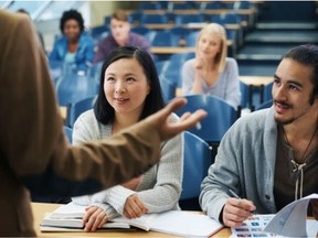 University students listen to a lecturer in this photo illustration.