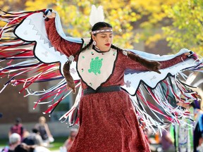 Shelby Lynn Soney performs the Butterfly Dance, or Fancy Dance, during official dedication of Turtle Island Walk on Sept. 21, 2017. The new pedestrian corridor replaced a stretch of Sunset Avenue from Wyandotte Street West to University Avenue West.