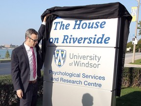 Dr. Antonio Pascual-Leone reveals the University of Windsor's Psychological Services Research Centre (PSRC) sign on Riverside Drive September 21, 2017.