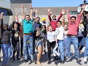 International students celebrate at St. Clair College's south campus, Sept. 22, 2017, after hearing the news that enrolment has hit 10,000 full-time students.