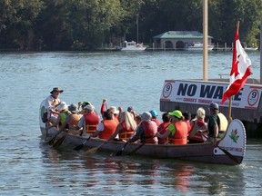Gordon Haggert, left, and Art Roth, right, of the Windsor Essex County Canoe Club shuttle hundreds of passengers to Windsor's Peche Island, shown in background, from Lakeview Park Marina Sept.23, 2017.  Saturday was Peche Island Day with free rides organized by the Detroit River Canadian Cleanup group.