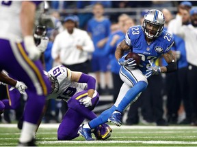 Darius Slay of the Detroit Lions runs the ball back after intercepting a pass in front of Adam Thielen of the Minnesota Vikings with 30 seconds left in the fourth quarter at Ford Field on Nov. 24, 2016 in Detroit. The Lions kicked a field goal as time ran out to defeat the Minnesota Vikings 16-13.