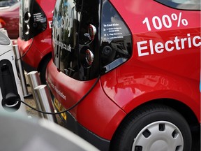 A charging plug connects an electric vehicle to a charging station on Aug. 17, 2017 in London, England.