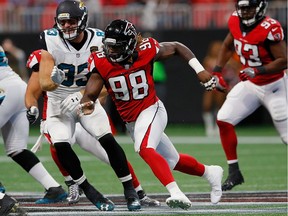 Takkarist McKinley of the Atlanta Falcons gives chase to Jonathan Grimes of the Jacksonville Jaguars at Mercedes-Benz Stadium on Aug. 31, 2017 in Atlanta, Ga.