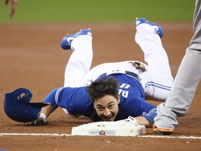 Toronto's Darwin Barney crawls into third base after stumbling in the second inning during MLB game action against the Baltimore Orioles at Rogers Centre on Sept. 11, 2017 in Toronto.