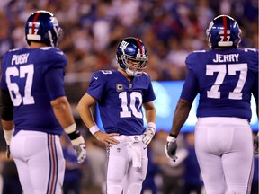 Eli Manning of the New York Giants looks on in the fourth quarter against the Detroit Lions during their game at MetLife Stadium on September 18, 2017 in East Rutherford, New Jersey.