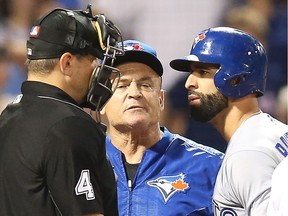 Toronto's Jose Bautista, right, is tossed out of the game in the eighth inning by home plate umpire Chad Fairchild during a game against the Boston Red Sox at Fenway Park on Sept. 25, 2017, in Boston