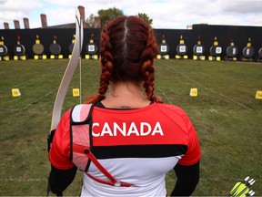 Elizabeth Newman, of Canada, competes in women's novice recurve archery during the Invictus Games 2017 on Sept. 28, 2017 in Toronto.
