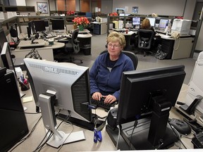 (file) 911 communicator Debbie Rafuse works in the 911 dispatch centre at Windsor Police headquarters on Jan. 14, 2011.