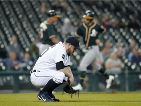 Detroit Tigers relief pitcher Alex Wilson reacts to allowing a Oakland Athletics' Jed Lowrie grand slam in the eighth inning of a baseball game in Detroit on Sept. 19, 2017.