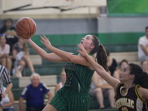 Herman's Alycea Williams goes for the layup while being chased by Catholic Central's Haiden Elliott in senior girls high school basketball action at Herman on Sept. 21, 2017. Ciara Emery scored nine points and  Williams added eight as Herman won 36-27. Karla Al Najm had 10 points for Catholic Central.