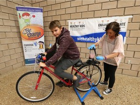 Eastwood Public School student  Carson Wood, 11, rides a blender bike at the Healthy Kids Community Challenge Youth Forum at the WFCU in Windsor on Sept. 29, 2017.  Jennipher Gee, a health promoter from the Windsor Essex Community Health Centre gave students the opportunity to combine physical activity and healthy eating.