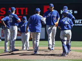 Toronto Blue Jays manager John Gibbons pulls pitcher Joe Biagini in the second inning against the Minnesota Twins on Sept. 17.