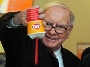 U.S. billionaire investor Warren Buffett flips over a Dairy Queen Blizzard treat