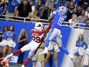 Detroit Lions wide receiver Kenny Golladay catches a 10-yard touchdown reception as Arizona Cardinals cornerback Justin Bethel defends during the second half of an NFL football game in Detroit, Sept. 10, 2017.