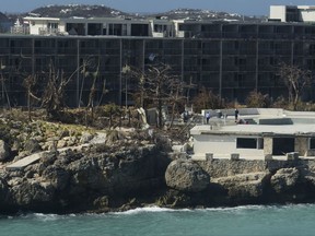 A damaged hotel stands after the passage of Hurricane Irma, close to the airport, in Phillipsburg, St. Martin, Monday, September 11, 2017. Irma cut a path of devastation across the northern Caribbean, leaving thousands homeless after destroying buildings and uprooting trees. (AP Photo/Carlos Giusti)