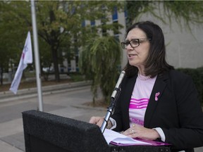 Audrey Festeryga, a volunteer with the CIBC Run for the Cure, gives remarks at a flag raising ceremony at Windsor city hall on Sept. 29, 2017, to proclaim October as breast cancer month.
