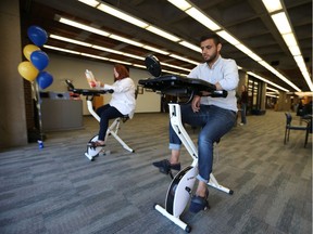 Windsor students use FitDesks at the Leddy Library on Sept. 11, 2017 in Windsor. The new exercise bikes and study station have been added to the library to help students stay fit.