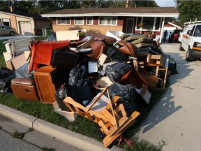 Furniture and household items damaged by the recent flood takes up the entire lawn of a South Windsor home on September 5, 2017.
