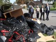 Essex County Warden Tom Bain, left, Essex Mayor Ron McDermott,  Ontario Municipal Affairs Minister Bill Mauro and Windsor Mayor Drew Dilkens tour flood damage in South Walkerville, Sept. 12, 2017.