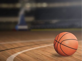 Close-up of a basketball on a court floor. Photo by Getty Images.