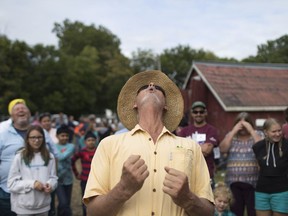 Warren Mullen competes in the rooster crow contest at the 163rd Harrow Fair, Saturday, Sept. 2, 2017.
