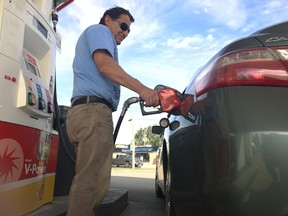 James Bailey of Windsor uses the pumps at the Shell station at Tecumseh Road East and Central Avenue - where the price was 123.9 cents per litre of regular on Sept. 1, 2017.
